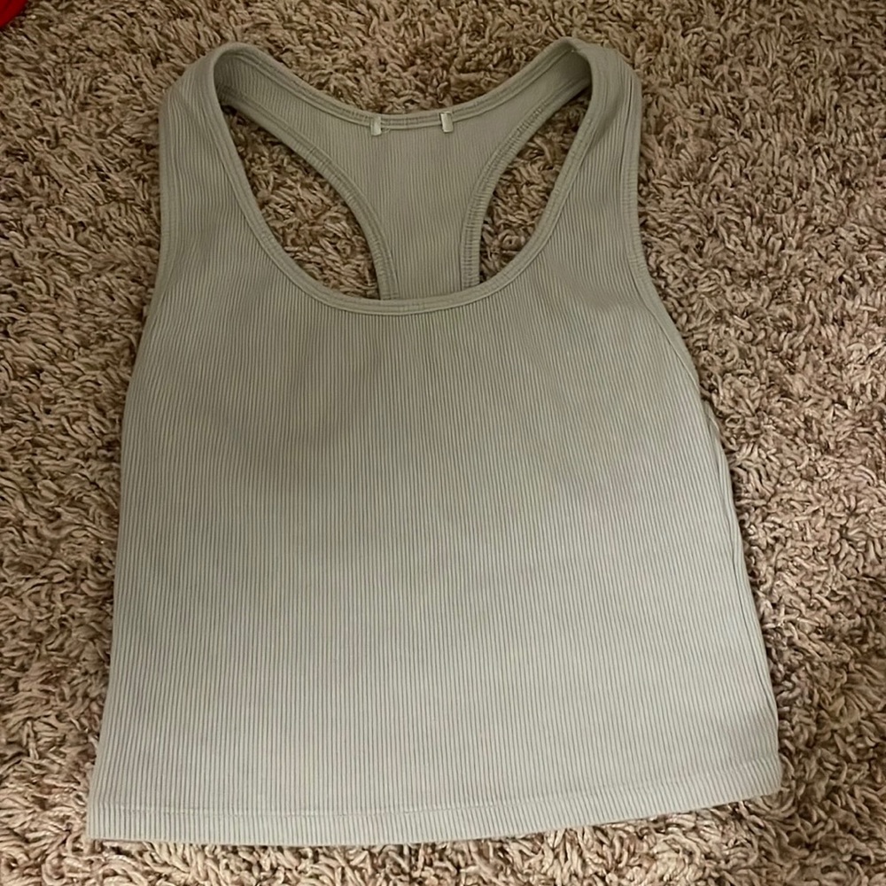 Cute light gray tank top not cropped. Super soft and thick straps.